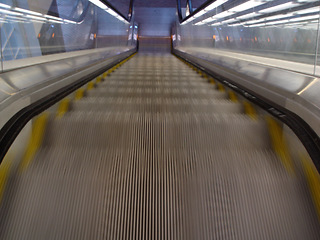 Image showing Top view, stairs and escalator in modern building for travel, moving and transport in airport. Metal, steel and closeup of electrical stairway in shopping mall, office or subway for urban commute