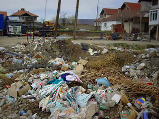 Image showing Pollution, damage and abandoned village with trash, rubble and recycling for climate change crisis. Landfill, community and garbage, debris and social poverty with waste, dirt or ruins in countryside