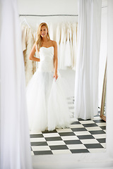 Image showing Wedding, dress and portrait of young bride in a luxury boutique, shop or store in a mall. Retail, style and female person from Canada preparing for marriage ceremony, party or reception for love.