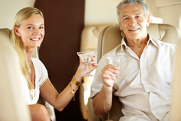 Image showing Portrait, happy couple and champagne in private jet on holiday, vacation and travel. Mature man, woman and alcohol glass on flight, toast and cheers in airplane transport, journey and smile together