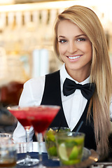 Image showing Woman, bartender and waitress with cocktails at restaurant for happy hour, hospitality industry or customer service. Portrait of happy worker, server or catering employee with alcohol drinks in glass