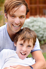 Image showing Portrait, man or boy in backyard with smile, hug and bonding in garden of home or house outdoor. Family, people or brother together with happiness and embrace for relax, peace or relationship in yard