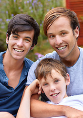 Image showing Portrait, men or brothers in backyard with smile, hug and bonding in garden of home or house outdoor. Family, people or child together with happiness and embrace for relax, peace or relationship