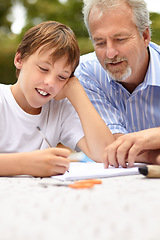 Image showing Family, son and father with homework outdoor for helping, learning and development with happiness at home. Man, child and notebook, writing or reading with stationary in backyard of house with smile