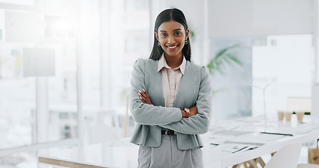 Image showing Business woman, portrait and smile with arms crossed in an office for confidence and career pride. Professional entrepreneur person from India at corporate company with positive attitude or happiness