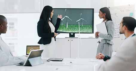 Image showing Business woman, presentation and wind turbine for eco friendly, sustainability and renewable energy meeting. Engineering manager and people with windmill model, design and screen of agriculture farm