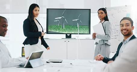 Image showing Business woman, presentation and wind turbine for eco friendly, sustainability and renewable energy meeting. Engineering manager and people with windmill model, design and screen of agriculture farm