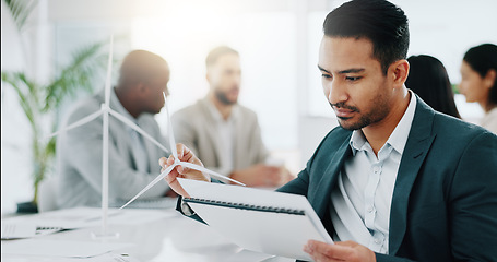 Image showing Business man, windmill model and office with documents, thinking and ideas for innovation, energy and sustainability. Engineer, consultant group and wind power for clean electricity with paperwork