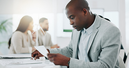 Image showing Wind turbine, planning and black man in office working on clean energy and sustainability electricity. Engineering, construction project and architect with eco friendly and biodiversity design