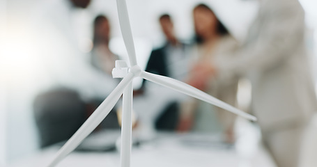 Image showing Business people, meeting and wind turbine for eco friendly, sustainability and renewable energy planning in office. Windmill model, design and engineering team with documents in agriculture solution