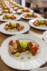 Image showing Catering concept, many plates with starter