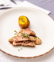 Image showing Baked potatoes with steak.