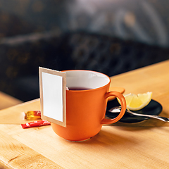 Image showing Mug of tea on the wooden table