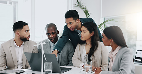 Image showing Business man, windmill and presentation in office with laptop, energy and sustainable future. Engineering consultant, leader and team for brainstorming, wind power and electricity on pc with speech