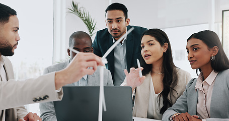 Image showing Wind turbine, computer and man in office team working on clean energy and sustainability planning. Engineering, construction project and architect job with eco friendly and biodiversity design