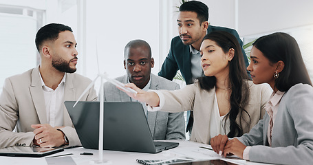 Image showing Wind turbine, computer and man in office team working on clean energy and sustainability planning. Engineering, construction project and architect job with eco friendly and biodiversity design