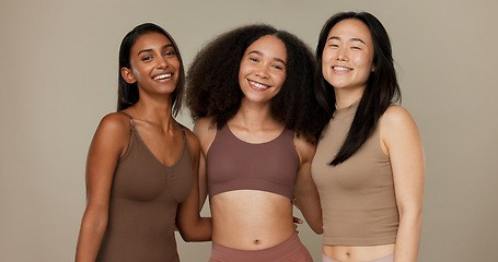 Image showing Diversity, underwear and portrait of women friends in studio for beauty, inclusion or wellness. Happy people hug on neutral background as different body care, skin glow or natural cosmetic comparison