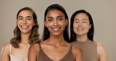 Image showing Beauty, diversity or smile of women friends in studio for portrait, inclusion or wellness. Face of happy people on neutral background as different skin care, dermatology glow or cosmetic comparison