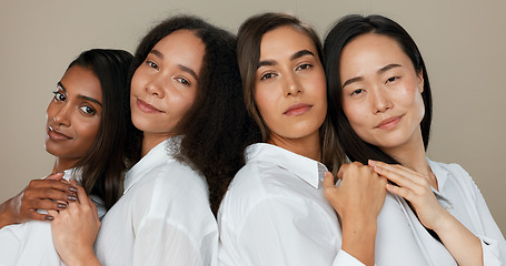 Image showing Women, face and skincare, group diversity with love, support and happy friends in portrait for cosmetics on a studio background. Young people smile together and hug for dermatology, beauty and makeup