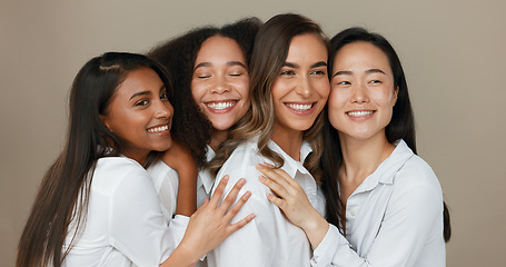 Image showing Women, group skincare and beauty with love, hug and support in diversity and inclusion on brown studio background. Friends, model or people smile together and kiss in dermatology, skin care or makeup