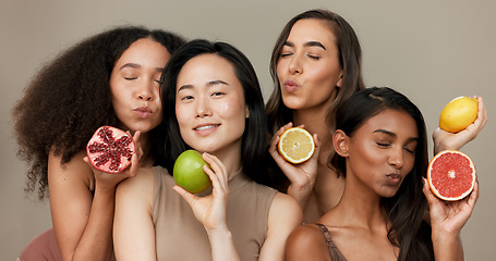 Image showing Women, portrait and beauty, diversity and fruit with dermatology and friends on studio background. Unique skin, natural cosmetics and inclusion, eco friendly skincare, smile and citrus for vitamin c