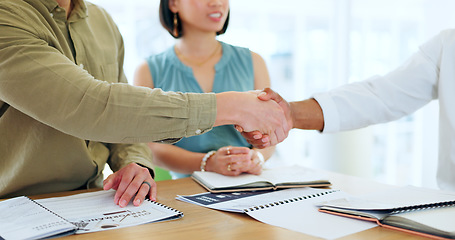 Image showing Business people, hand shake and documents for partnership deal, contract or agreement in company office. Shaking hands, men and woman after negotiation, meeting or collaboration for corporate work