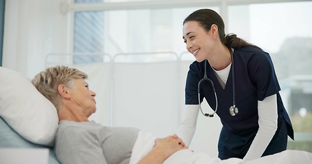 Image showing Doctor, conversation and senior woman in hospital bed for healthcare with support for retirement. Female medical, expert and care with elderly female for medical treatment at clinic for advice.