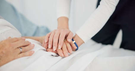 Image showing People, holding hands and care for life, support or trust in commitment, understanding or grief at hospital. Closeup of women touching in healthcare for loss, illness or virus on bed at the clinic