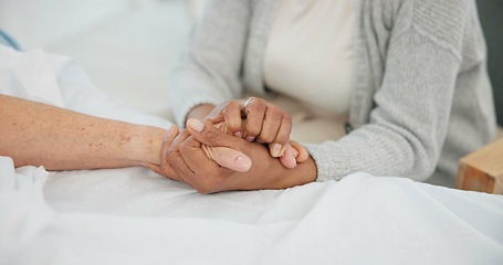 Image showing Senior couple, support and holding hands in hospital with love and care at clinic. Elderly patient, kindness and marriage with trust and healthcare with medical help and homecare with empathy