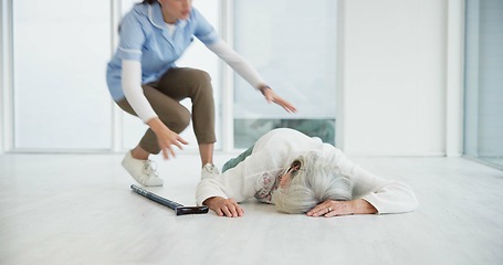 Image showing Accident, help and nurse with old woman on floor for medical, injury and elderly care. Emergency, healthcare and pain with caregiver and patient in nursing home for rescue, retirement and risk