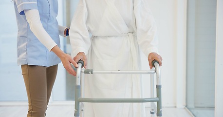 Image showing Nurse, senior woman and walker for helping hand, show support and guide in rehabilitation at clinic. Caregiver, elderly person with disability and mobility frame with empathy, physiotherapy and care