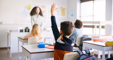 Image showing Education, question and teacher with boy in classroom for learning, discussion and knowledge. Help, studying and hands raised with children and woman at school for why, scholarship and answer