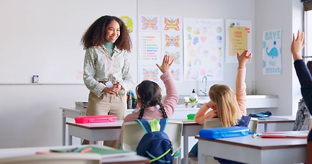 Image showing Education, answer and teacher with boy in classroom for learning, discussion and knowledge. Help, studying and hands raised with children and woman at school for why, scholarship and questions