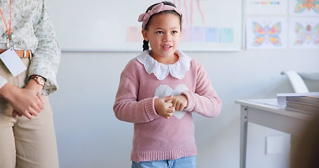 Image showing Girl child, classroom presentation and speech for oral assessment with teacher, development and language. Shy female kid, story and speaking for test, exam and education in class, school or academy