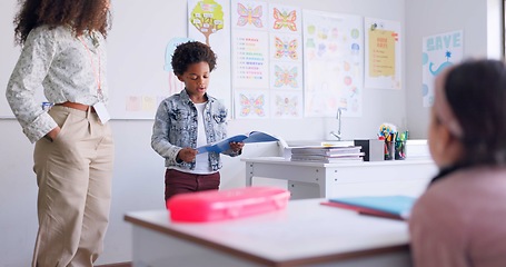 Image showing Child, kid reading and classroom with talking speaker, book and education at a school. Students, learning and notebook with development, knowledge and study with story discussion of youth assessment