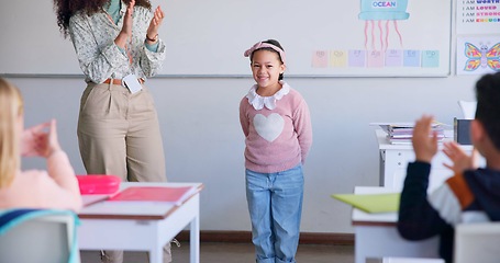 Image showing Class, presentation success and child speaker with applause and cheering in classroom at school. Young kid, education and oral reading of project with student and teacher with children in discussion