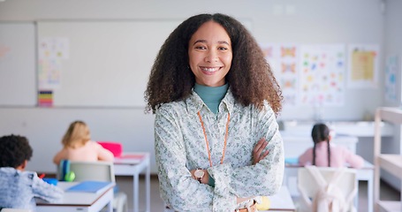 Image showing Female teacher, arms crossed and smile in class with school kids, pride or happy for education career. Woman, classroom and learning expert for children, face or portrait with development for future