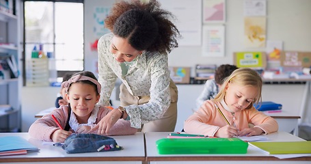 Image showing Help, teacher and woman in a classroom, students and education with studying, conversation and knowledge. Person, educator and children writing, learning and kids with answers, explain and lessons