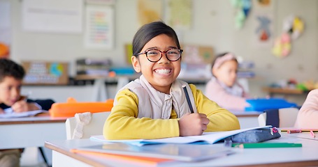 Image showing Smile, learning and study with girl in classroom for education, knowledge and writing. Scholarship, happy and future with portrait of young student at school for academy, exam test and project