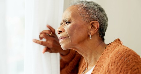 Image showing Senior woman, face and thinking by window at home to remember memory and relax in retirement. Serious black elderly person or old lady at nursing facility with hope, sad emotion and Alzheimer disease