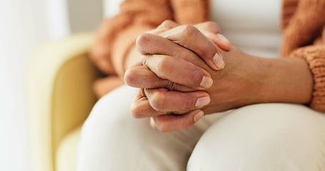 Image showing Hands, stress and senior woman on a sofa with anxiety, fear or grief, dementia or scared in her home. Stress, worry and nervous elderly female in a living room with Alzheimer, arthritis or depression