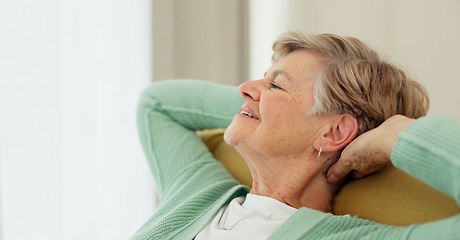 Image showing Stretching, relax and senior woman on a sofa happy, chilling and satisfied in her home. Stretch, relief and elderly female smile for retirement, freedom and me time in a living room with good mood