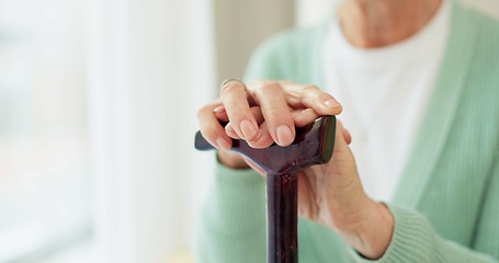 Image showing Cane, retirement and support with hands of old woman for cancer, medical and person with a disability. Rehabilitation, healthcare and walking stick with closeup of person in nursing home for balance