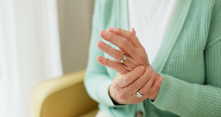 Image showing Hands, pain and arthritis with a senior woman in her nursing home, struggling with a medical injury or problem. Healthcare, ache or carpal tunnel with an elderly resident in an assisted living house