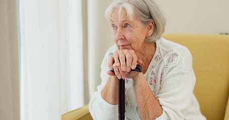 Image showing Senior woman, cane and thinking on home sofa to remember memory and relax in retirement. Serious and sad elderly person or old lady with a disability at nursing facility with Alzheimer and depression