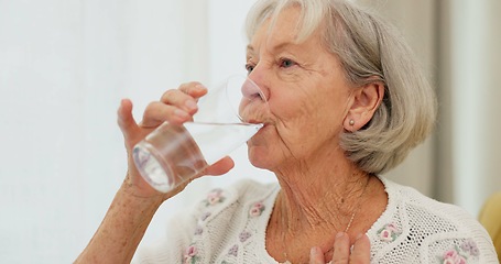 Image showing Health, thirsty and mature woman drinking water for hydration and liquid diet detox at home. Wellness, fresh and calm elderly female person enjoying glass of cold drink in modern retirement house.