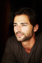 Image showing Thinking, serious and fashion of man in studio isolated on a black background. Contemplation, idea and handsome or attractive model planning in casual clothes, trendy or stylish on a dark backdrop