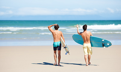 Image showing Surf, walking and beach sports people, friends or men travel on sand to ocean waves, sea water or nature mockup. Surfboard, surfing partner and back of surfer for vacation, wellness and adventure