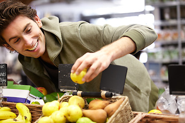 Image showing Man, smile and fruit in grocery store for health diet, nutrition or shopping sale product. Male person, happy customer and apple choice in supermarket for organic vegan, quality price or fibre food