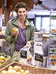 Image showing Man, portrait and fruit shopping in grocery store for fibre nutrition, vegan food and healthy choice. Male person, smile and peach bag supermarket for organic health diet, vitamins or happy customer